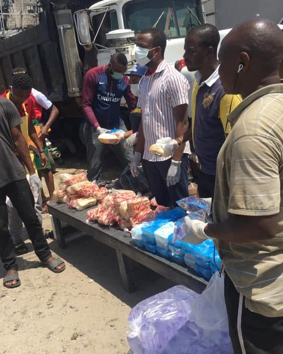 Volunteers handing out bread and relief supplies at a Jesus Markets outreach